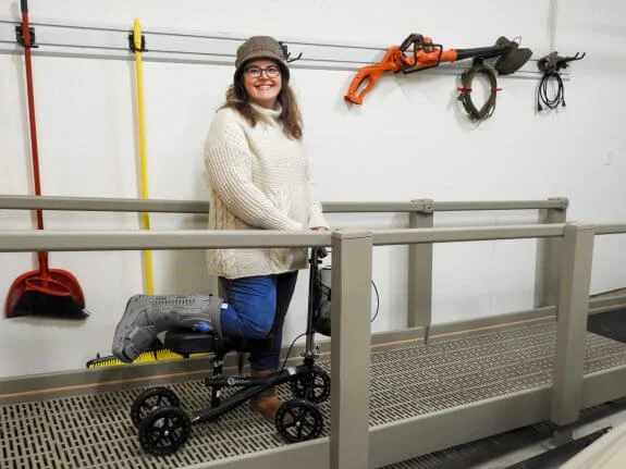 Janice using ramp and knee walker