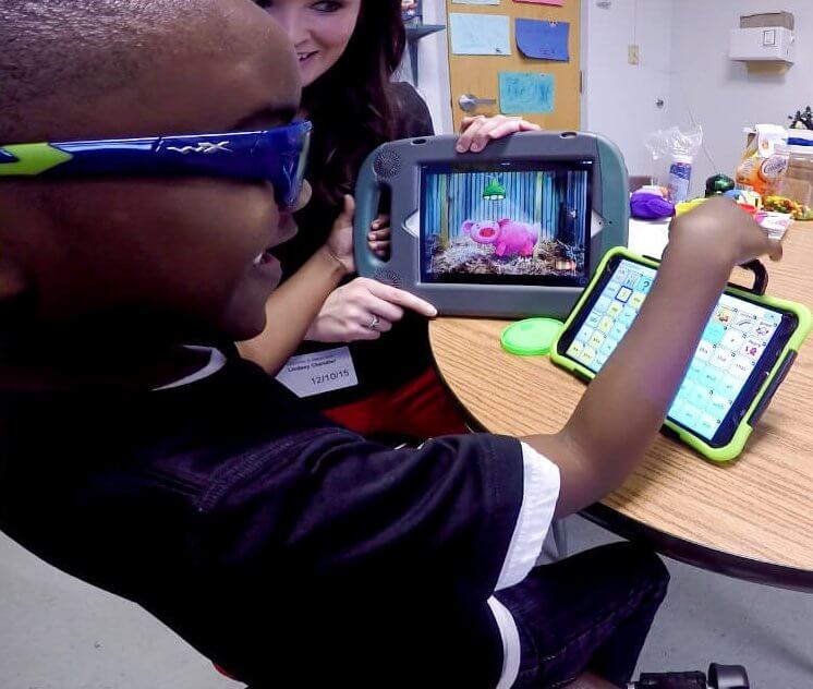 Child using a tablet as assistive technology