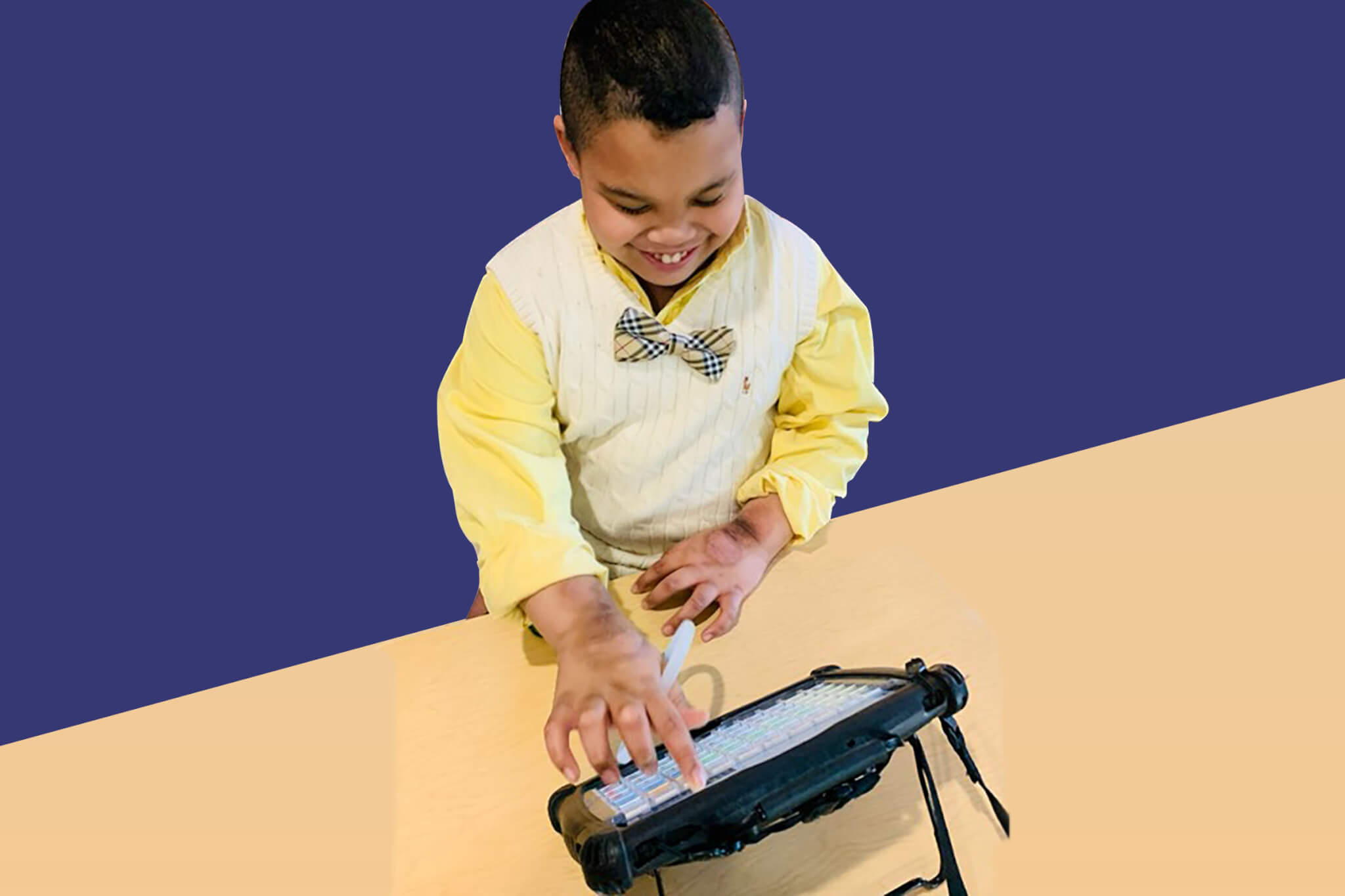 Young boy using an AAC device