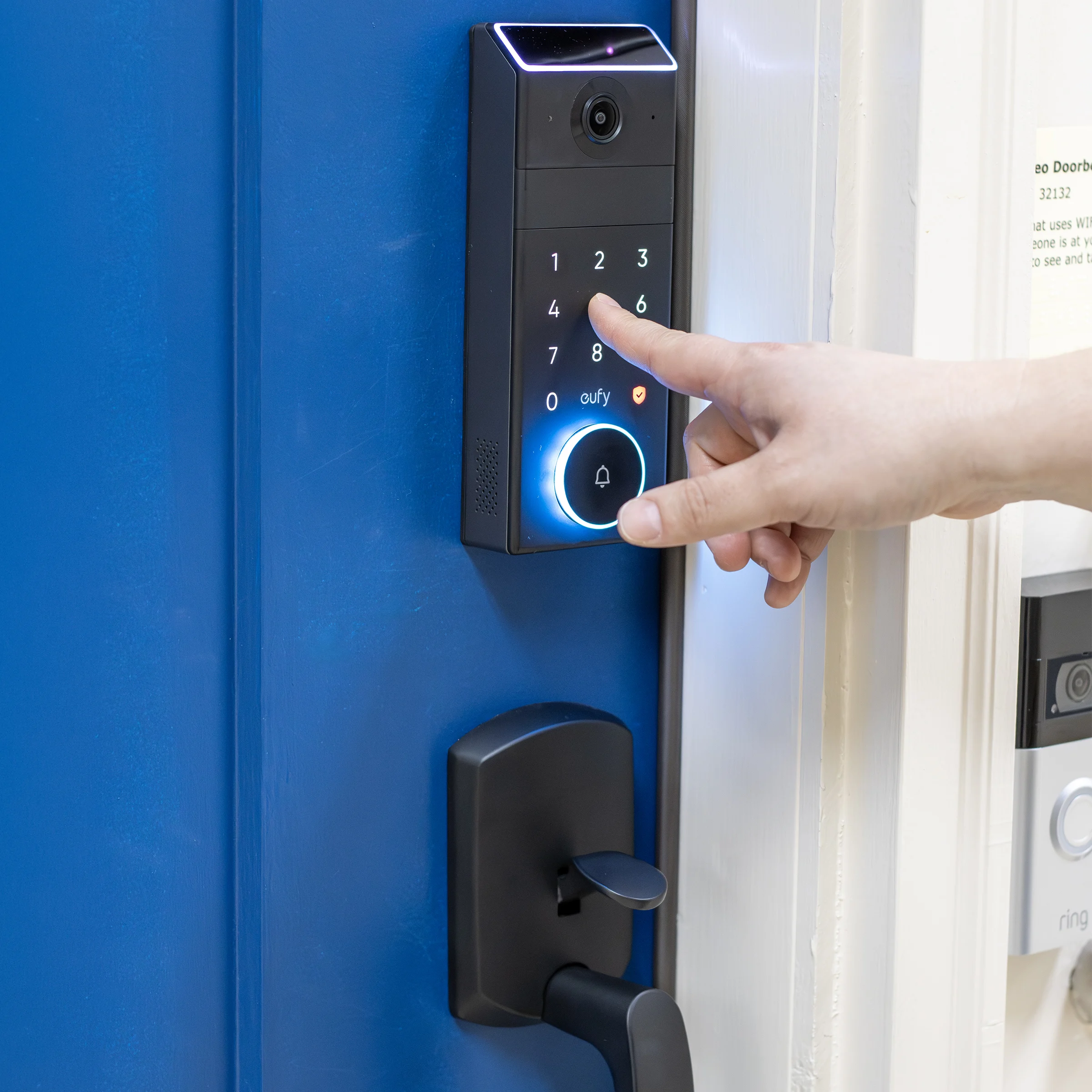 person using the keypad on a door