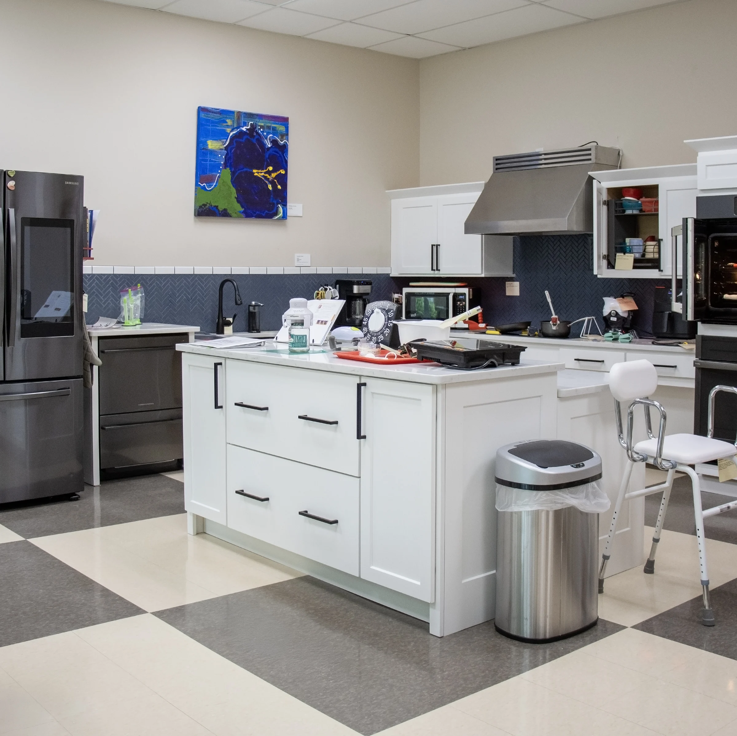 IATP’s smart home kitchen that depicts various accessible kitchen items including a microwave, a coffee maker, and an assortment of small appliances and containers.